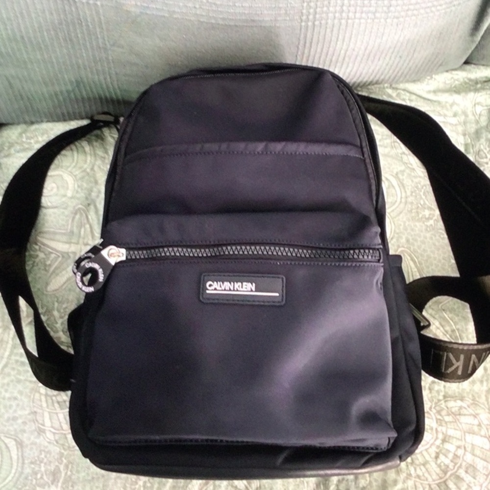 Calvin Klein navy blue backpack with pockets for water bottles